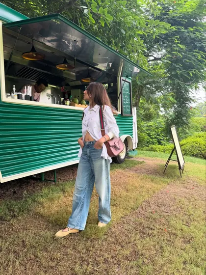 Another shot of the oversized shirt and jeans look, this time by a cute food truck.