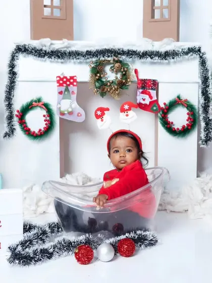 This cute little Santa is ready for a bath in our festive Christmas setup, complete with trees and a fireplace.