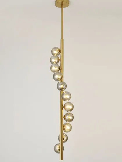 A spiral pendant with smoked glass globes, perfect for a staircase or a room with a high ceiling. The design draws the eye upward.
