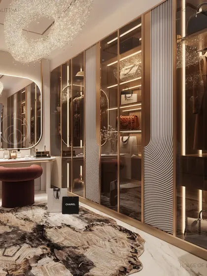 For us, luxury is personal. This walk-in closet celebrates the private joy of getting ready, with custom glass wardrobes, soft integrated lighting, and a dedicated vanity space. Every detail is tailored to feel like a personal boutique.