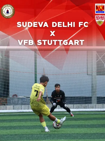 A player takes a shot on goal under the watchful eye of the goalkeeper during the VfB Stuttgart collaboration camp. These moments are where training translates into goal scoring confidence.