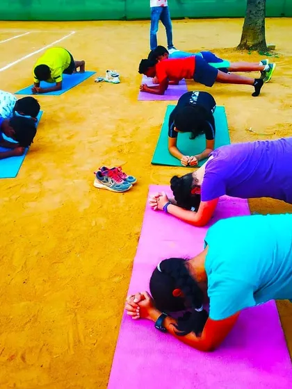 We build complete athletes, focusing on both mind and body. Our training incorporates core strengthening exercises and yoga on the court to improve fitness, endurance, and mental focus.