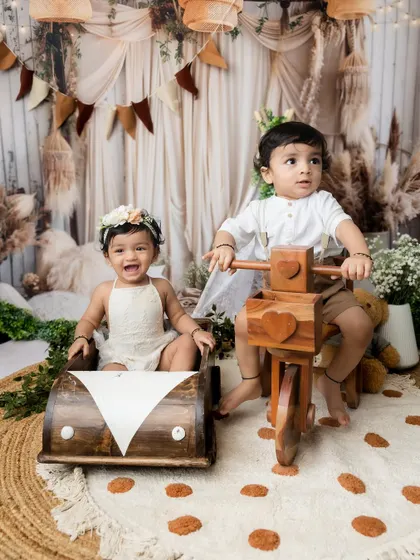 The siblings switch places with the wooden toys, showing their playful interaction.