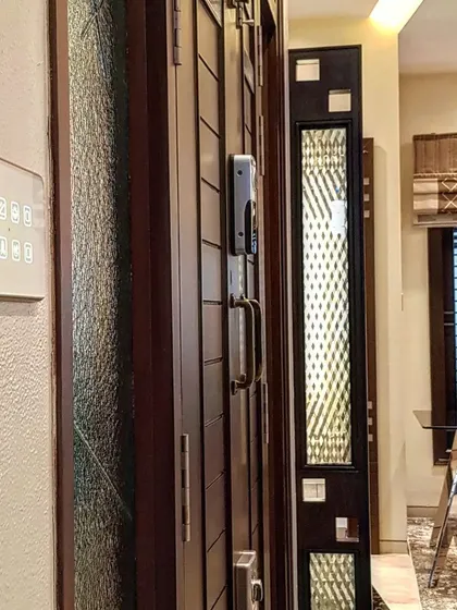 A smart lock and a customized touch panel installed side by side. This setup shows how I combine robust security with centralized home control, all integrated cleanly into your entryway's design.