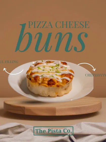 Introducing our Pizza Cheese Buns, the perfect savory snack. This image shows a single, fluffy bun on a clean white plate, topped with melted cheese and a sprinkle of herbs, promising a soul-filling and cheesy bite every time.