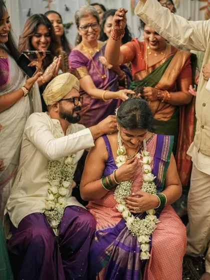 Surrounded by the love of family during my wedding rituals. I chose a sleeveless blouse for my muhurtham because feeling like myself was my top priority. I encourage my clients to make bold choices that honor their comfort and personal style, even during traditional ceremonies.