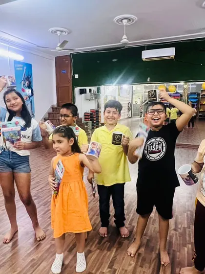 Happy faces after a great session. I believe in celebrating small wins, and here the kids are proudly showing off their prizes. This is the kind of positive community we are building.