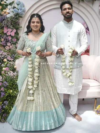 The couple exchanging garlands, a beautiful tradition captured forever.