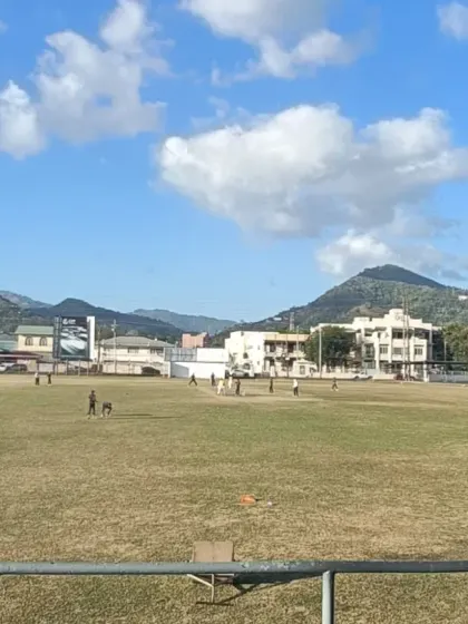 A wide shot of the beautiful cricket ground in Trinidad where our team played, showcasing the great culture of cricket worldwide.