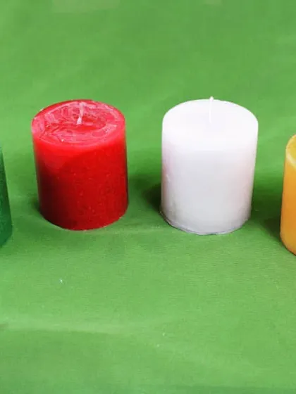 Another arrangement of my small pillar candles, this time showing green, red, white, and yellow. I can create custom color assortments for your order.