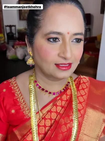 It’s an honor to get the mother of the bride ready for the big day. For her reception, we chose a graceful and elegant look with a soft shimmer on the eyes, a classic red lip, and glowing skin that looks beautiful both in person and in photos.