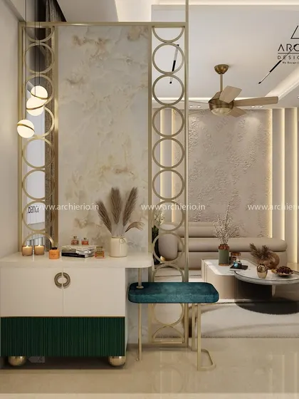 A unique partition and console table design with gold-finished metal circles, creating a stylish and functional separation of space.