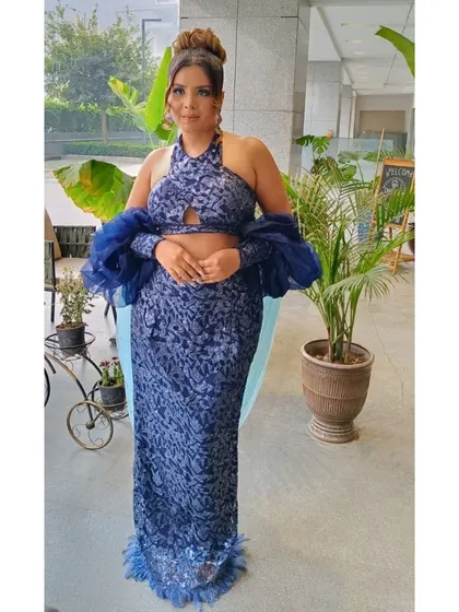 A complete look at a party makeover, perfect for an evening event. The client's makeup features a subtle smokey eye and a nude lip, which allows her stylish blue outfit to be the star of the show.
