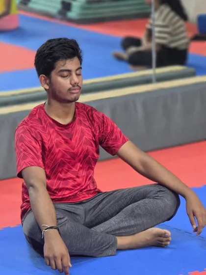 Mental strength is the foundation of resilience. This student takes a moment for quiet reflection, a practice we encourage to build focus and determination.