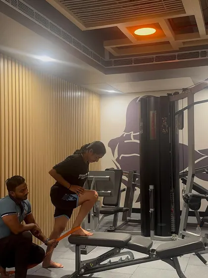 Working one-on-one with an athlete on a corrective exercise. We're using a resistance band to activate her glutes and improve her movement patterns.