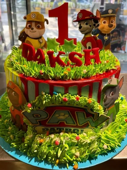 No job is too big, no pup is too small for this Paw Patrol birthday cake. This design features a grassy texture made from frosting and edible toppers of the heroic pups.