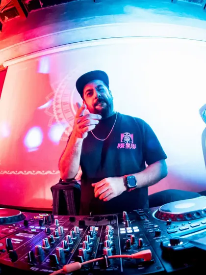 A fisheye lens shot of me on the decks at Roxy, giving a unique perspective of the DJ booth.