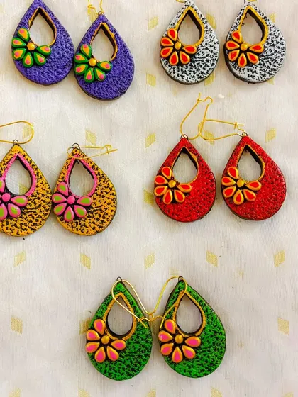These images display the extensive variety of earrings I create, from jhumkas to studs and danglers, all showcasing different patterns, colors, and shapes ready for bulk orders.