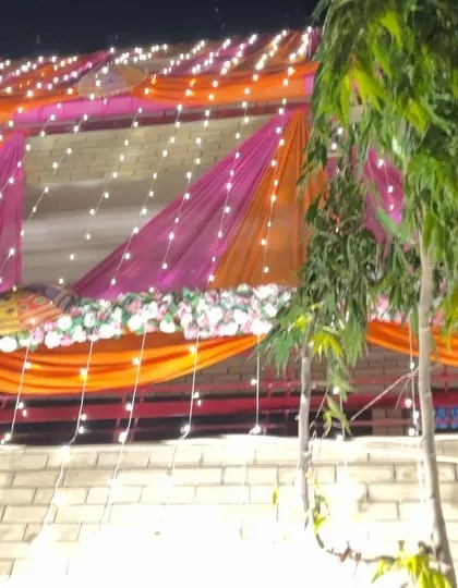 Another angle of the colorful house decoration, showing the beautiful patterns created by the drapes and lights.