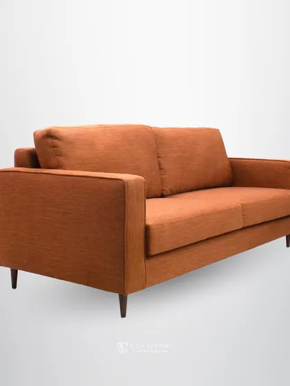 The angled profile of this sofa showcases its classic mid-century silhouette. It's a timeless design that we can customize in any fabric or size to fit your home perfectly.