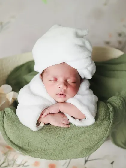 A little spa day, anyone? We create these fun and whimsical scenes, like this one with a baby relaxing in a tiny tub surrounded by fluffy clouds, to make your newborn shoot extra special.