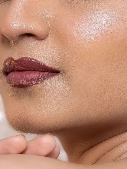 This shot highlights the skin finish and lip color paired with the dramatic eye. I teach how to balance a bold feature with the rest of the makeup for a cohesive look.