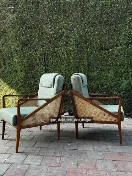 A back-to-back shot showing the profile and cane work on both chairs.