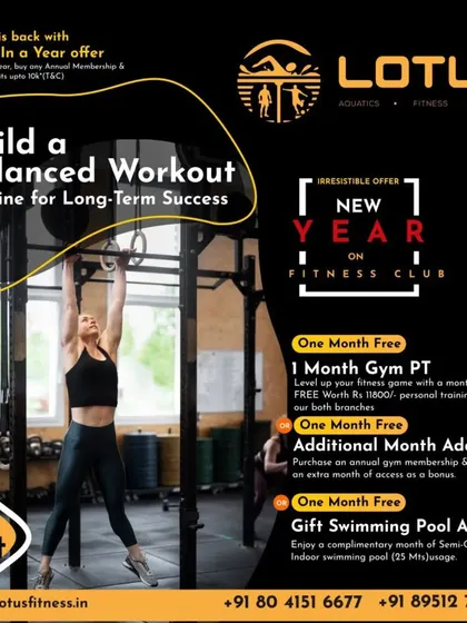 Long-term success comes from a balanced workout routine. Here, a member performs a pull-up on gymnastic rings, an exercise that builds comprehensive upper body and core strength.