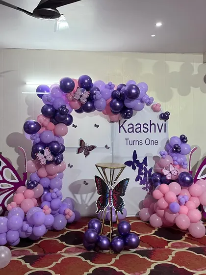 Another perspective of the purple and pink butterfly decoration, highlighting the intricate balloon work.