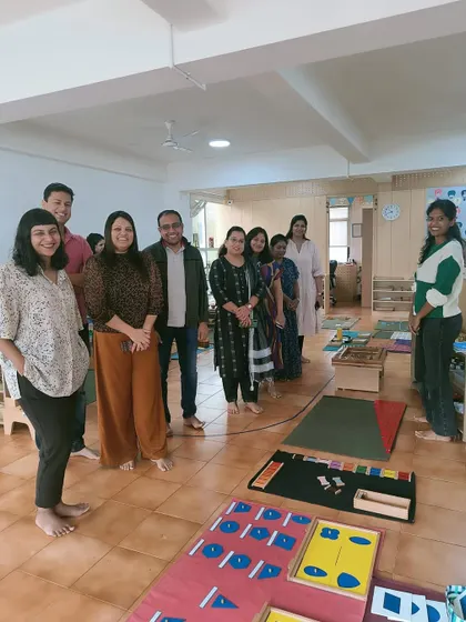 A group photo of parents and teachers at an orientation session. Building a strong, informed parent community is a priority for us.
