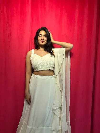 A confident pose in the off-white Indo-Western set, perfect for showcasing your style at a cocktail party or reception.