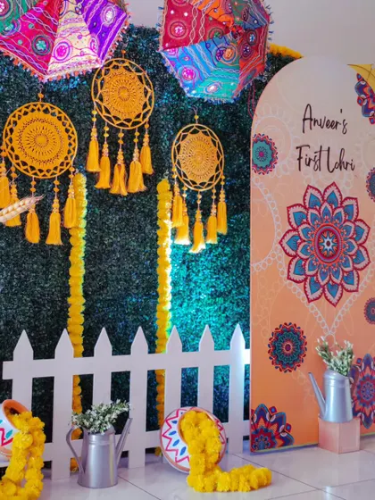 Another angle of the "First Lohri" party, showing the picket fence and other props that add to the charming, festive look.