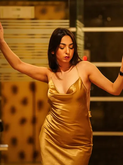 I'm bad with words, I hope you're good at reading eyes. A close-up, moody shot in a golden satin dress.