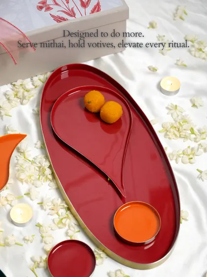 Designed to do more. Our Bindu collection, including the large oval tray, can serve mithai, hold votives, or simply elevate every ritual with its symbolic shape and rich color.