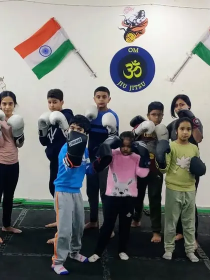 A focused group of kids and adults ready for their striking class. We believe in training together as a family, where everyone learns from each other regardless of age or size.