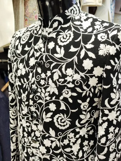 Another view of the black and white floral Jodhpuri on a mannequin, highlighting its unique and eye-catching pattern.