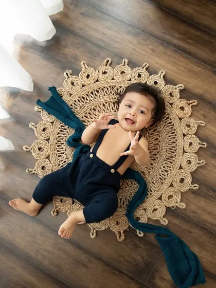The joy of movement! This little one is so happy, lying on a jute mat with a beautiful soft fabric.