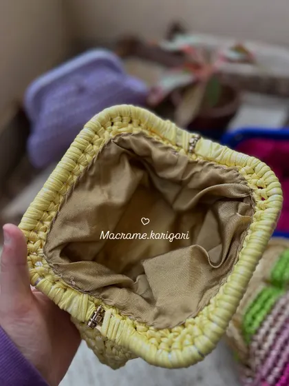 A look inside one of our handmade clutches, showing the smooth satin lining. We pay attention to every detail, ensuring the inside is as well-crafted as the outside.
