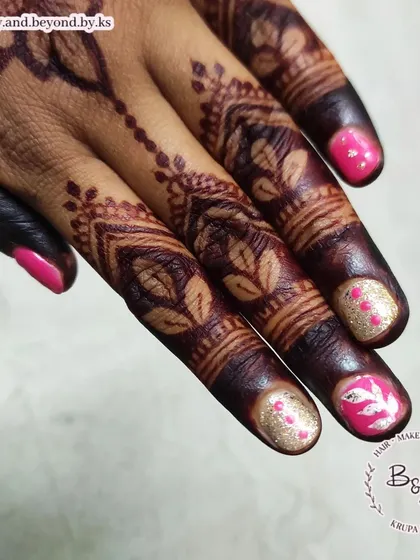 Another detailed shot of the pink and gold nail art, perfect for Indian festive occasions.