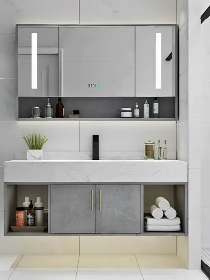 This bathroom features a high-tech mirrored cabinet with integrated vertical lighting, perfect for daily routines. The floating vanity provides ample storage with both closed cabinets and open shelves.