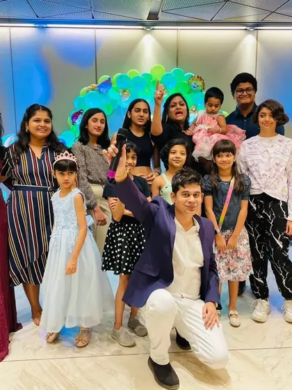 A group photo with the birthday girl and her friends after a fantastic party.