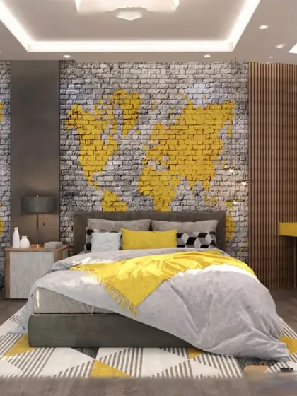 This bedroom has an industrial-chic vibe with a brick-effect wall featuring a world map. The yellow and grey color scheme, along with a dedicated study desk, makes it a cool and functional space for a teen.
