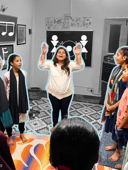 An instructor leads her students with open arms and a joyful expression, encouraging them to sing out. Her energy is infectious, inspiring even the shyest children to participate.