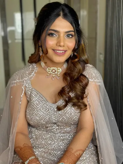 A final look at this beautiful client. The soft curls and elegant styling make this a perfect choice for a sangeet or reception.