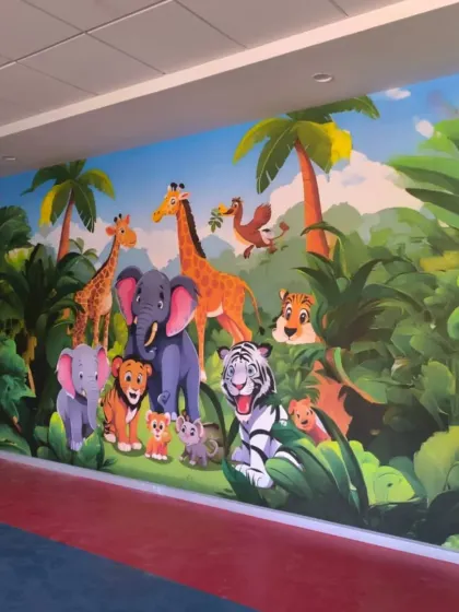 A full view of the jungle animal mural in a hallway, turning a simple passage into a delightful experience for kids.