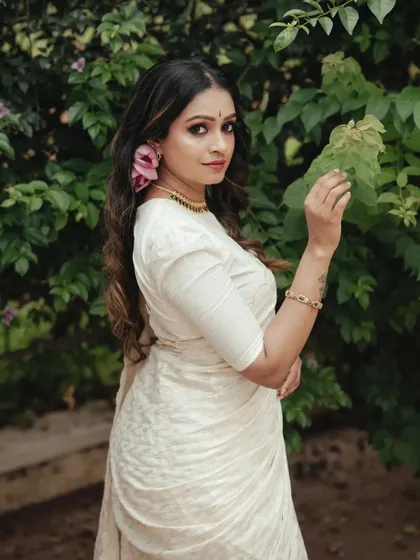 A portrait that feels both classic and contemporary. Her confident look towards the camera, combined with the traditional Onam attire, creates a powerful and stylish image.