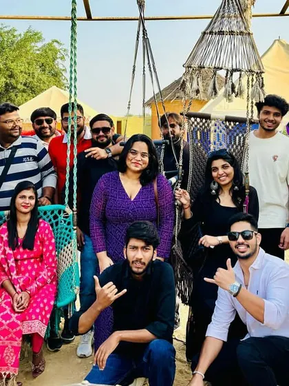The travel tribe chilling at the desert camp. Our stays are comfortable and provide great spots for group photos and making memories.