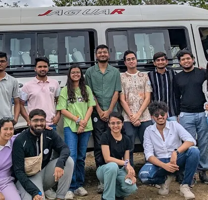 The travel crew for our Hogenakkal trip, posing with our trusty traveller bus that takes us from Bangalore and back.