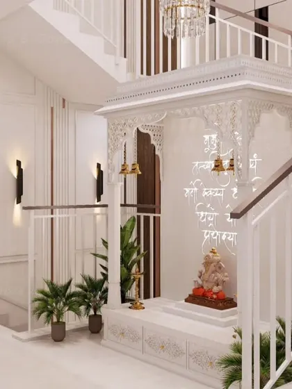 A side view of the Corian mandir, showcasing the detailed craftsmanship of the jali work and the hanging brass bells. The design is both traditional and timeless.