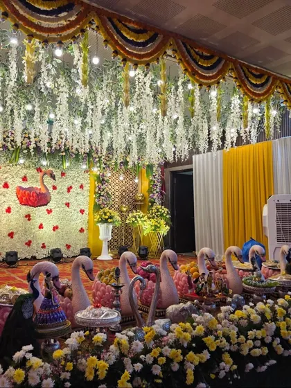 Another view of the swan-themed stage with its hanging white floral ceiling.